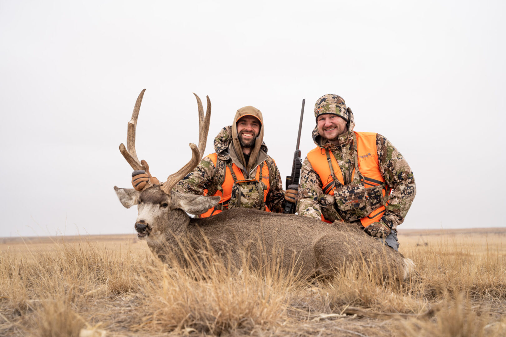 Hunters with an elk